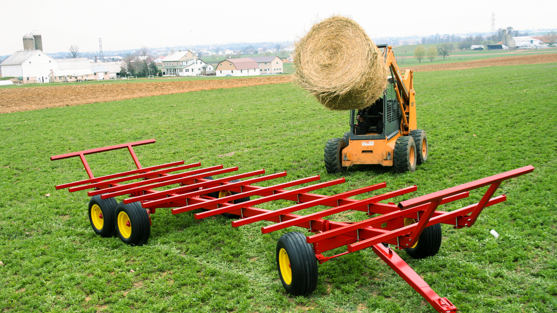 round bale about to be placed on wagon for round bales for horses for sale article